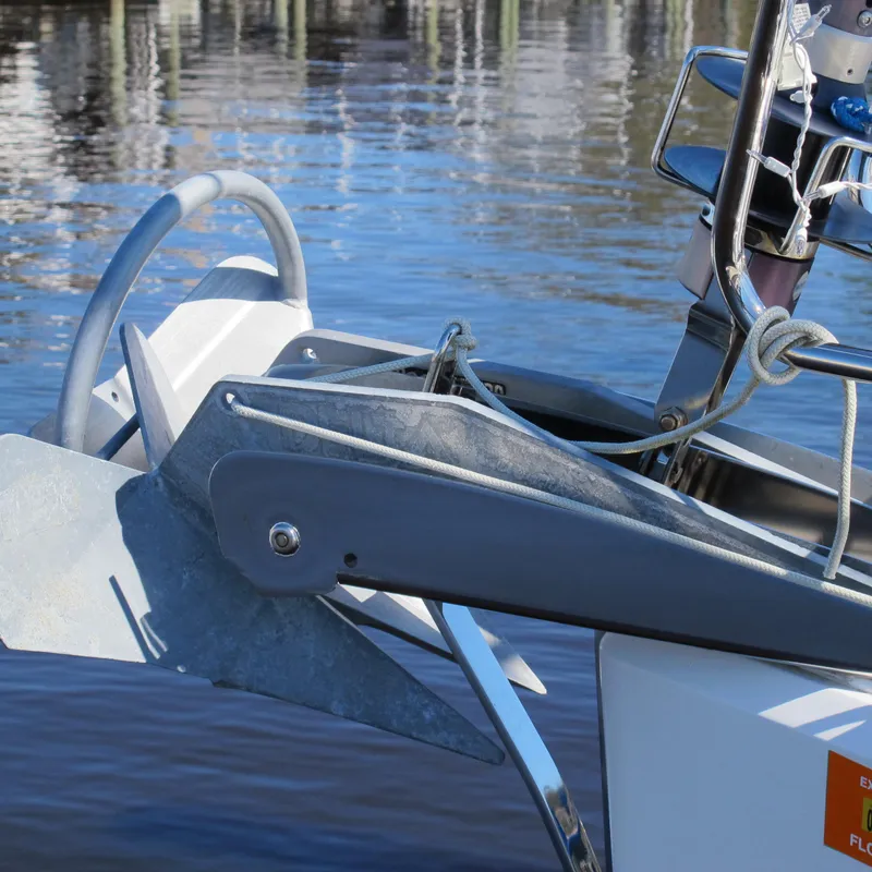 Slide: The Image of Jeanneau Sun Odyssey 379 (2013) sailboat anchor detail by the water. - 6