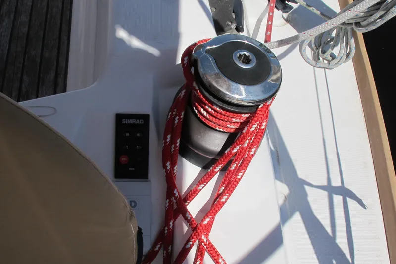 Slide: The Image of Winch with red rope on 2013 Jeanneau Sun Odyssey 379 sailboat deck. - 65