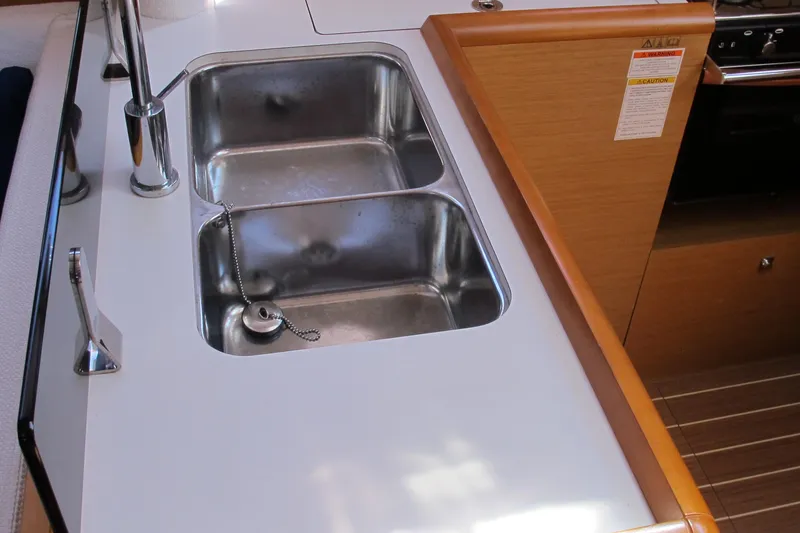 Slide: The Image of Galley sink in 2013 Jeanneau Sun Odyssey 379 yacht, featuring a modern stainless steel design. - 69