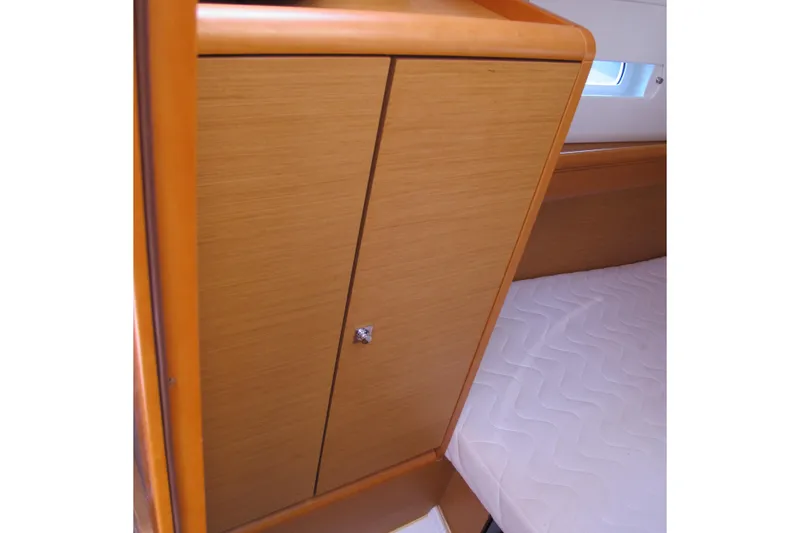 Slide: The Image of Wooden cabinet and bed inside 2013 Jeanneau Sun Odyssey 379 yacht cabin. - 72