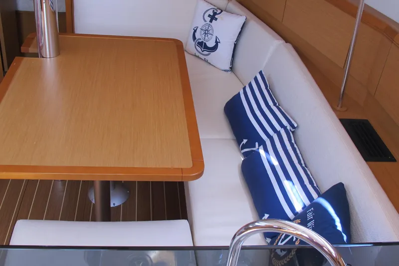 Slide: The Image of Cozy interior of 2013 Jeanneau Sun Odyssey 379 with nautical-themed cushions. - 75