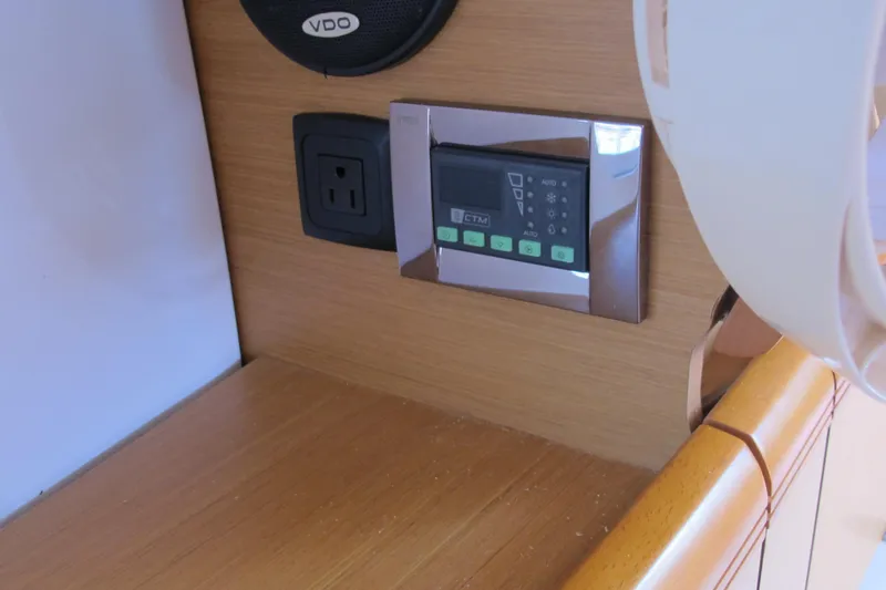 Slide: The Image of Control panel and outlet on Jeanneau Sun Odyssey 379 yacht, 2013 model. - 76