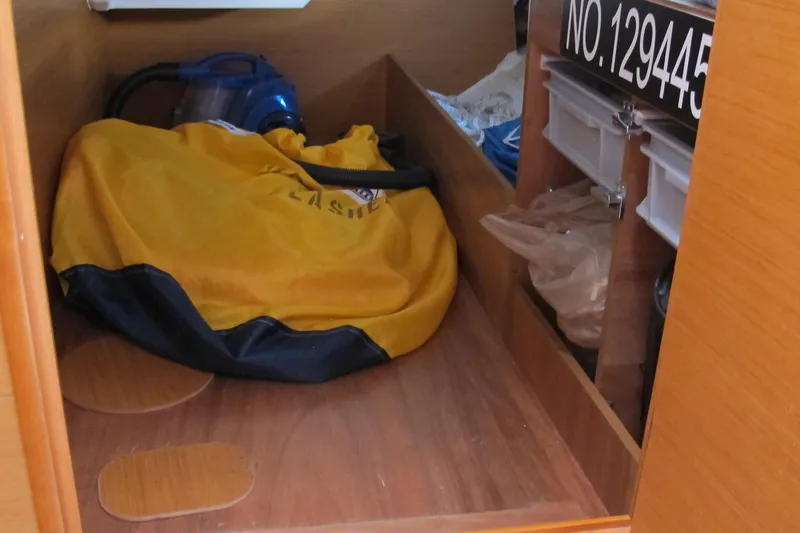 Slide: The Image of Interior storage area of 2013 Jeanneau Sun Odyssey 379 sailboat with equipment and supplies. - 85