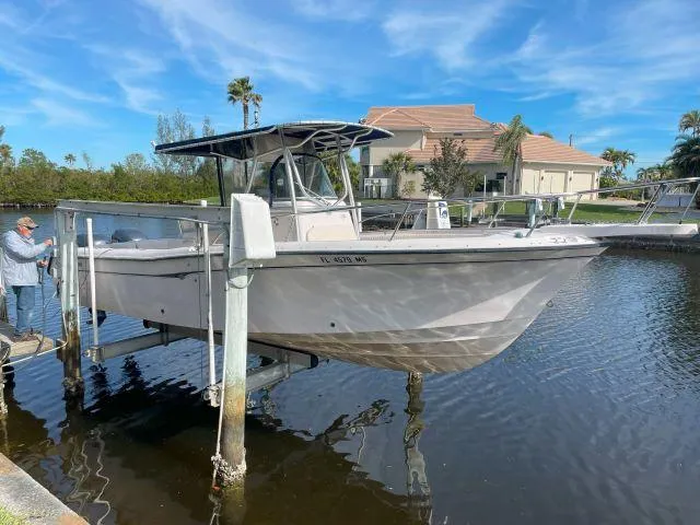 Slide: The Image of 2005 Grady-White 283 RELEASE boat on lift, docked near waterfront home. - 0