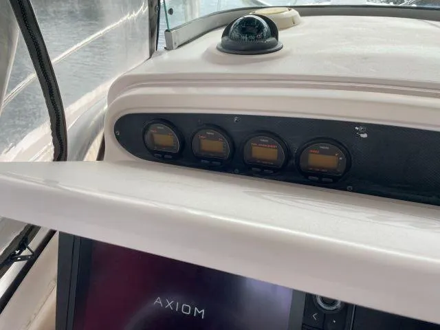 Slide: The Image of Dashboard of 2005 Grady-White 283 RELEASE boat with navigation instruments. - 11