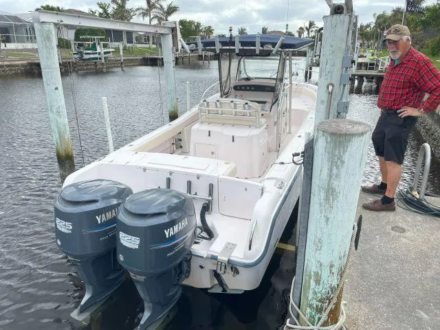 Slide: The Image of 2005 Grady-White 283 RELEASE boat docked with dual Yamaha engines. - 2