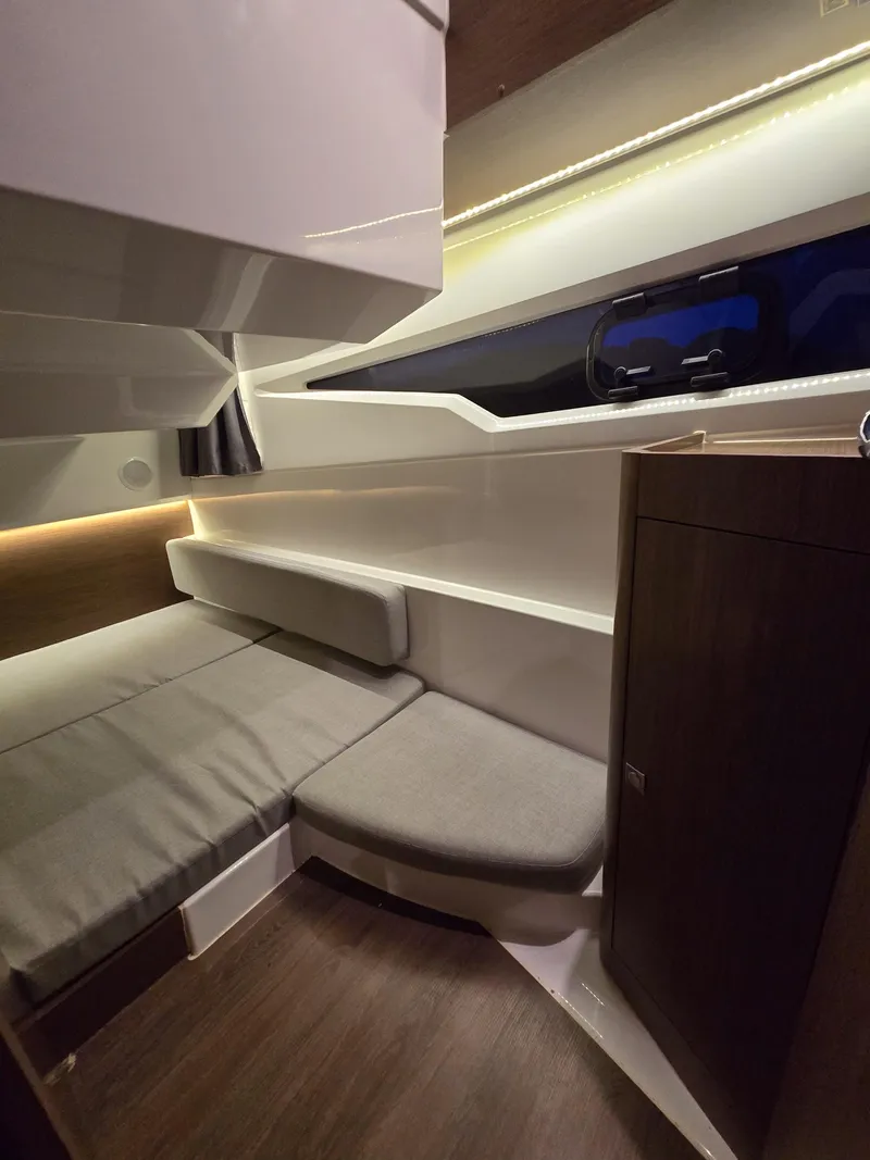 Slide: The Image of 2021 Jeanneau NC895 cabin interior with modern design and cozy seating area. - 15