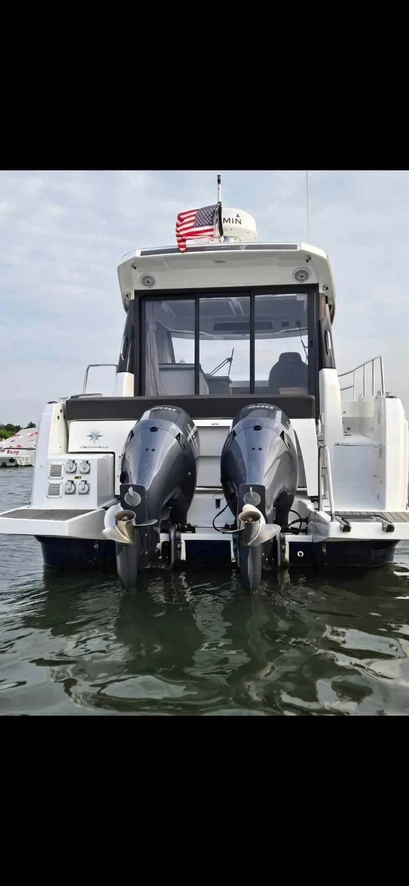 Slide: The Image of 2021 Jeanneau NC895 boat with dual outboard motors on water. - 33