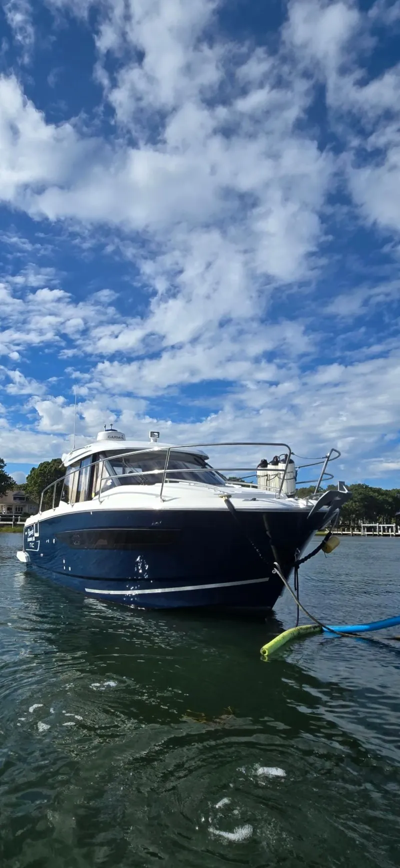 Slide: The Image of 2021 Jeanneau NC895 boat on water under a partly cloudy sky. - 41