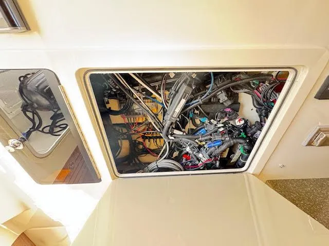 Slide: The Image of 2016 Boston Whaler 350 Outrage electrical compartment with wiring and components visible. - 40