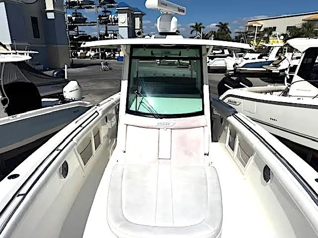 Slide: The Image of 2016 Boston Whaler 350 Outrage boat docked at a marina. - 7
