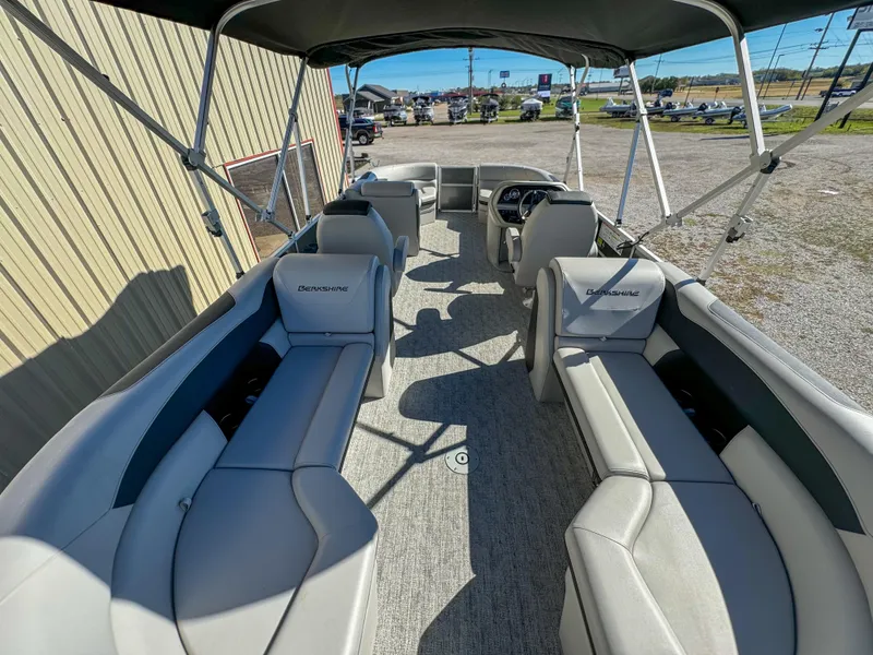 Slide: The Image of 2024 Berkshire 24RFXLE pontoon boat interior with spacious seating and canopy. - 10