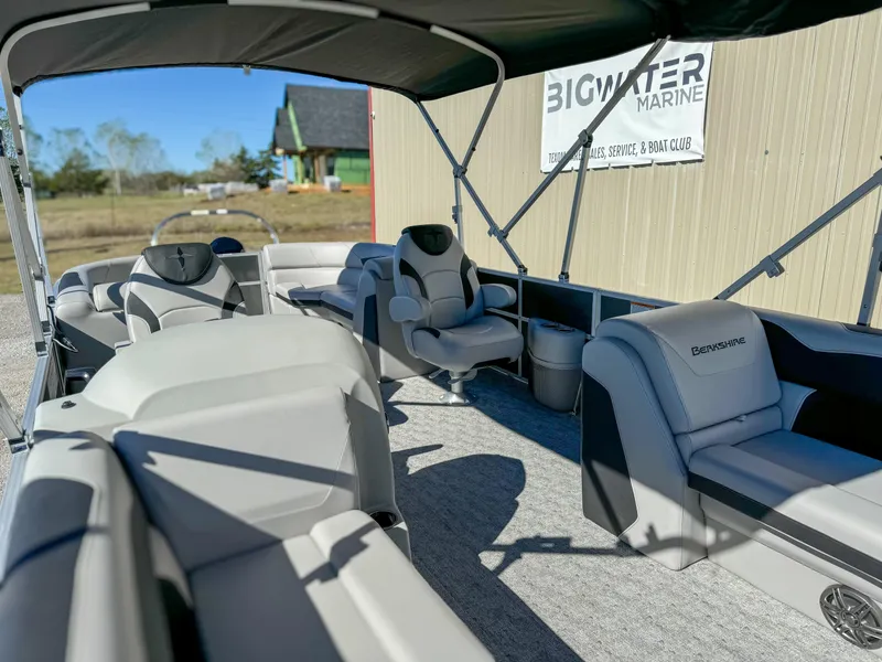 Slide: The Image of 2024 Berkshire 24RFXLE pontoon boat interior at Big Water Marine dealership. - 11