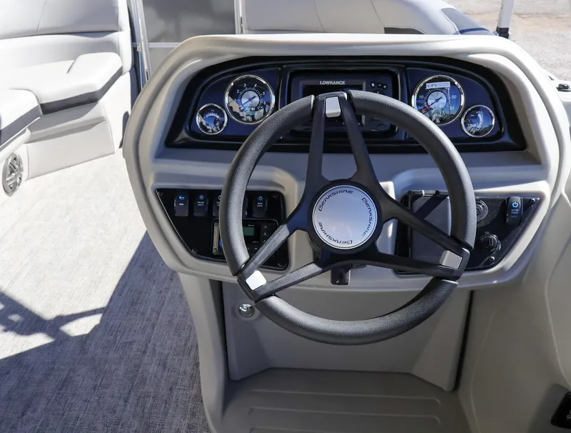Slide: The Image of 2024 Berkshire 24RFXLE boat steering console with modern controls and gauges. - 6