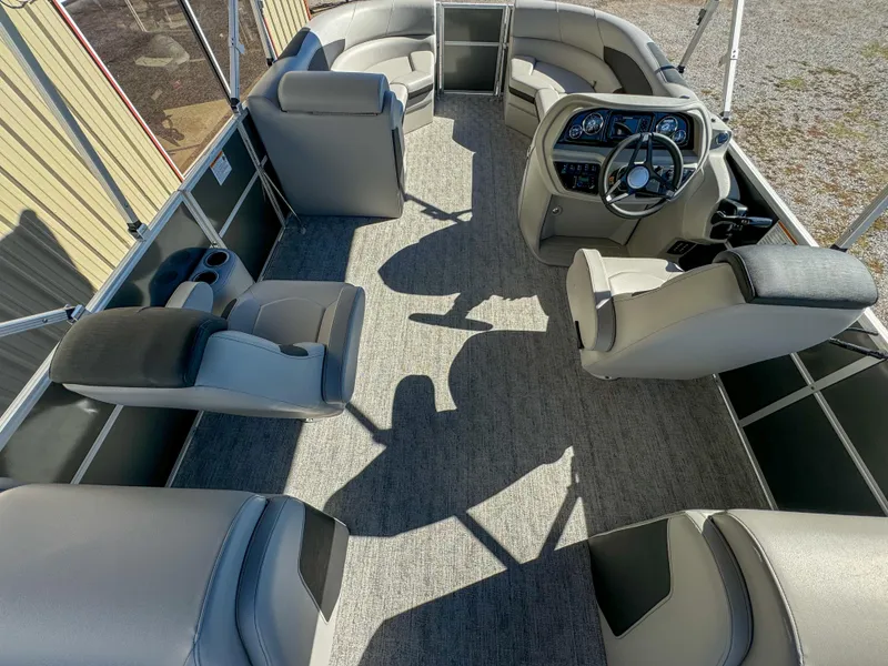 Slide: The Image of 2024 Berkshire 24RFXLE pontoon boat interior with plush seating and modern helm. - 8