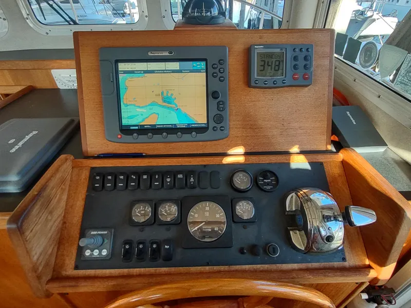 Slide: The Image of Control panel of a 2006 Nordic Tug 32 with navigation equipment. - 32