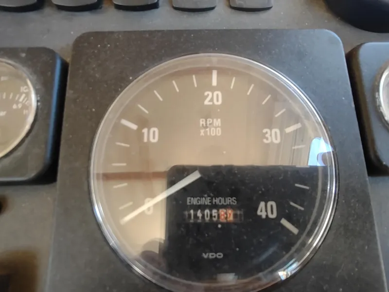 Slide: The Image of Tachometer of 2006 Nordic Tug 32 showing RPM and engine hours. - 33