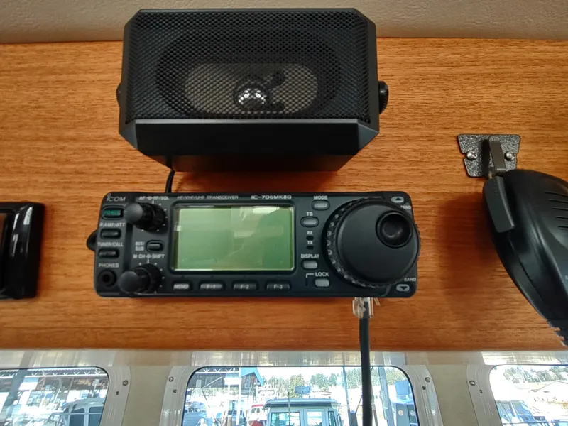 Slide: The Image of Marine radio and speaker on 2006 Nordic Tug 32 boat dashboard. - 34
