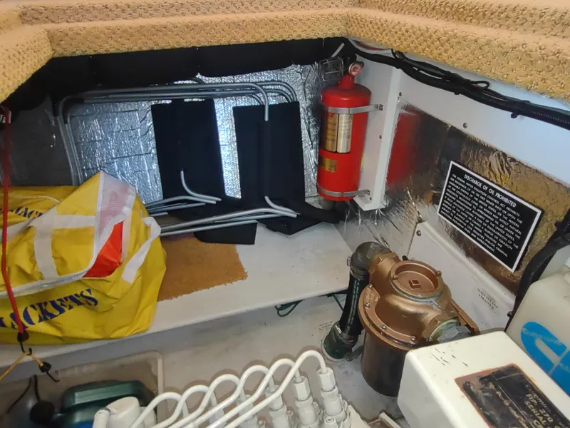Slide: The Image of Engine room of 2006 Nordic Tug 32 with fire extinguisher and equipment. - 49