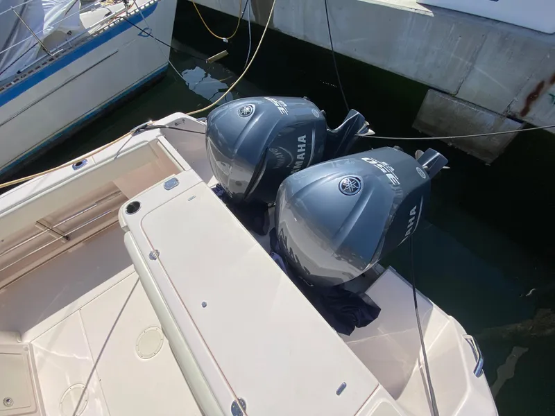Slide: The Image of 2016 Grady-White Canyon 306 with dual Yamaha outboard engines docked. - 10