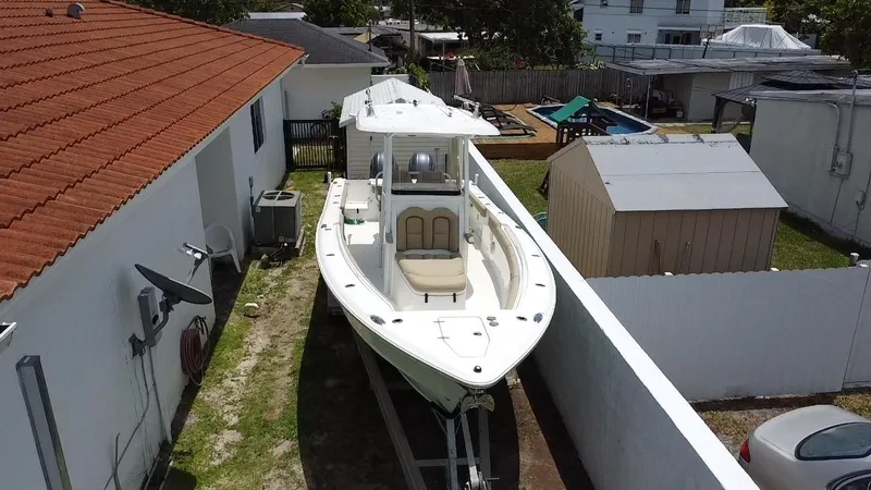 Slide: The Image of 2017 Sea Hunt Gamefish 27 with Coffin Box parked beside a house. - 5