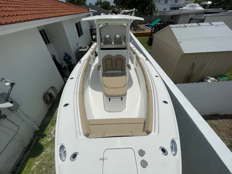 Slide: The Image of 2017 Sea Hunt Gamefish 27 with Coffin Box, aerial view, docked beside buildings. - 6