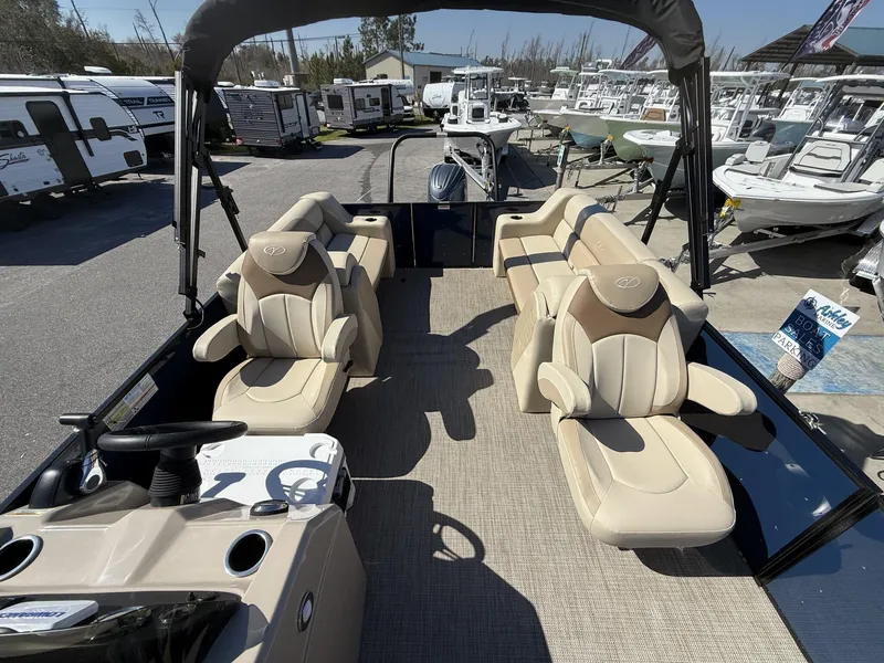Slide: The Image of 2025 Veranda Vista View Series boat with luxurious seating at a marina. - 11