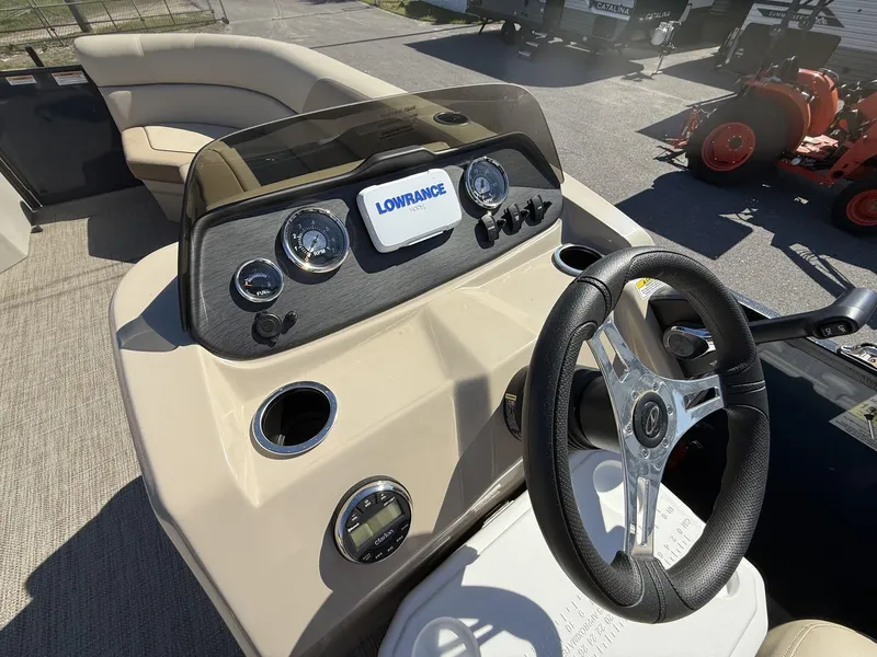 Slide: The Image of 2025 Veranda Vista View Series boat dashboard with steering wheel and gauges. - 5
