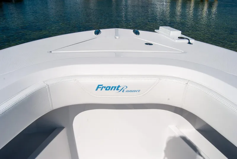 Slide: The Image of 2025 Front Runner 36 Center Console boat, white interior, on calm water. - 14