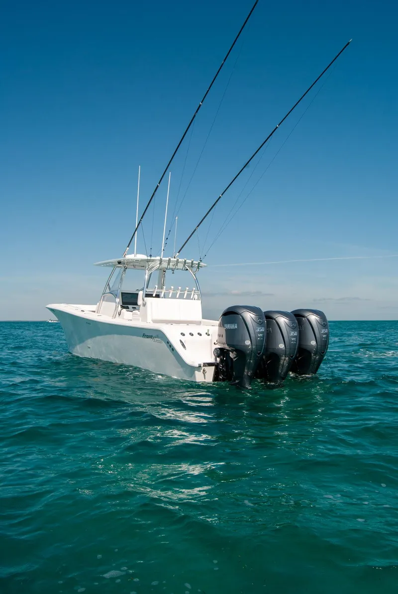 Slide: The Image of 2025 Front Runner 36 Center Console boat on open sea with triple engines. - 18