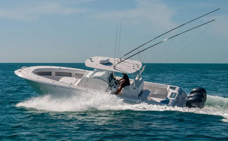 Slide: The Image of 2025 Front Runner 36 Center Console boat cruising on open water. - 19