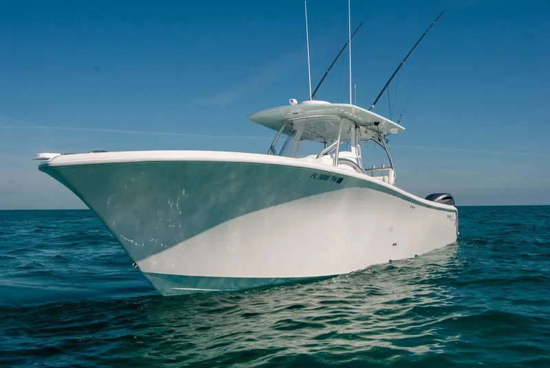 Slide: The Image of 2025 Front Runner 36 Center Console boat on open water, clear blue sky. - 23