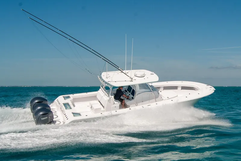 Slide: The Image of 2025 Front Runner 36 Center Console boat speeding on open water. - 30