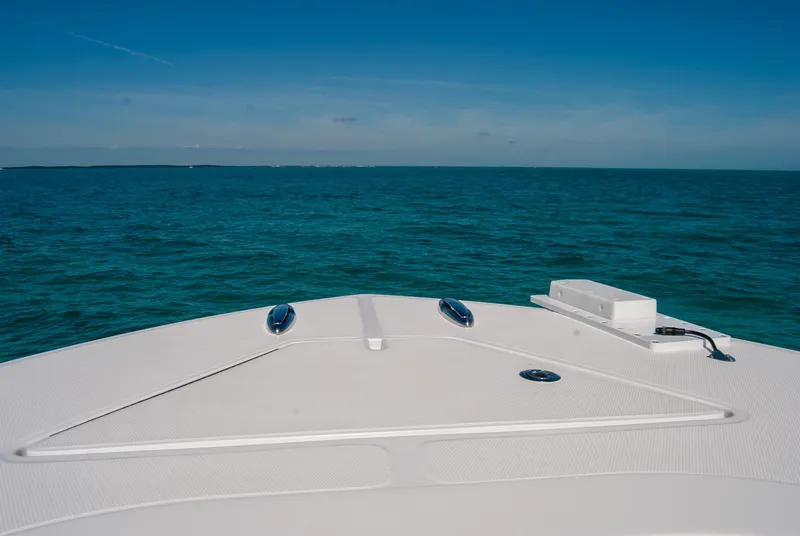 Slide: The Image of 2025 Front Runner 36 Center Console boat on open sea under clear blue sky. - 9