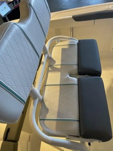 Slide: The Image of 2025 Tahoe 2150 CC boat seating with cushioned backrests and diamond-pattern upholstery. - 12