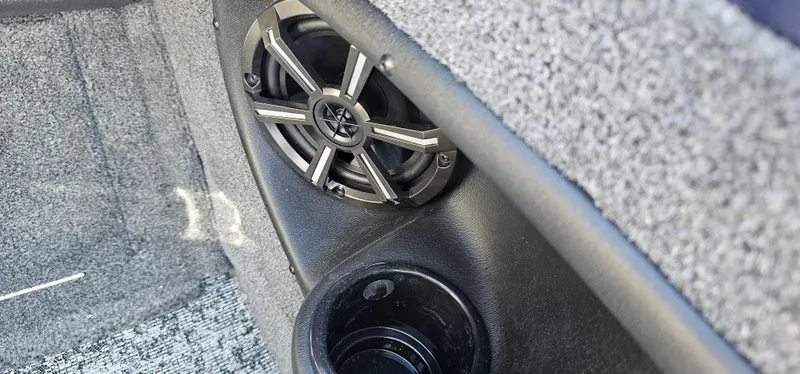 Slide: The Image of Speaker and cup holder in 2025 Tracker Targa V-19 WT boat interior. - 12