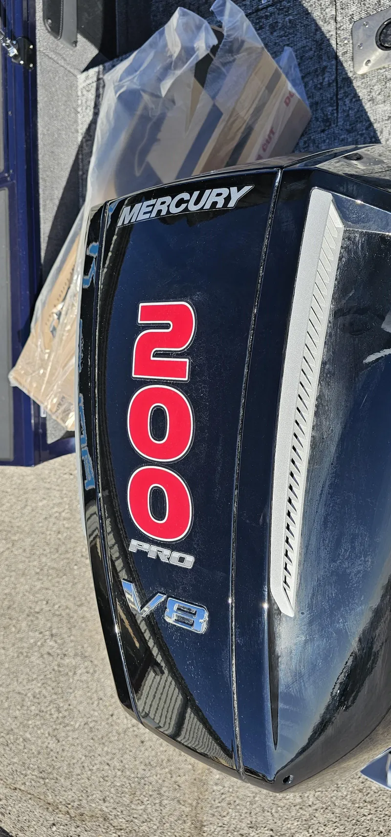 Slide: The Image of Mercury 200 Pro V8 engine cover on 2025 Tracker Targa V-19 WT boat. - 16