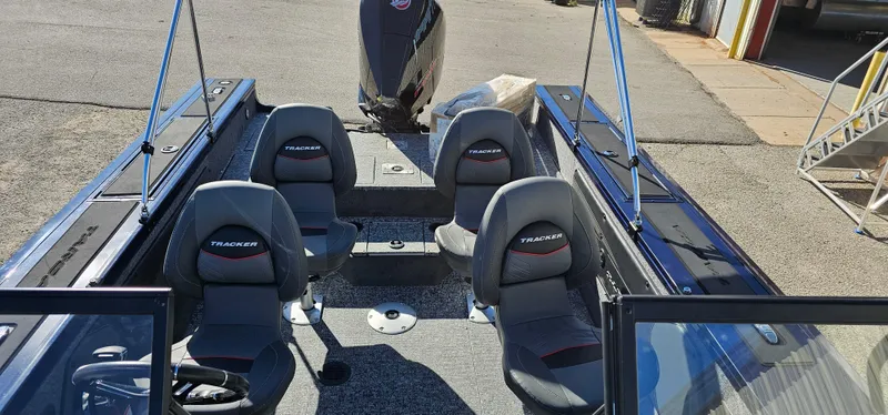 Slide: The Image of 2025 Tracker Targa V-19 WT boat interior with four seats and motor. - 4