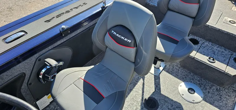 Slide: The Image of 2025 Tracker Targa V-19 WT boat interior with gray seats and red accents. - 5