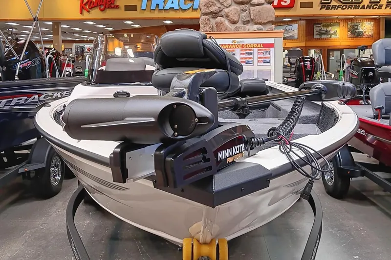 Slide: The Image of 2025 Ranger VS1682SC Reata boat with Minn Kota motor displayed indoors. - 1