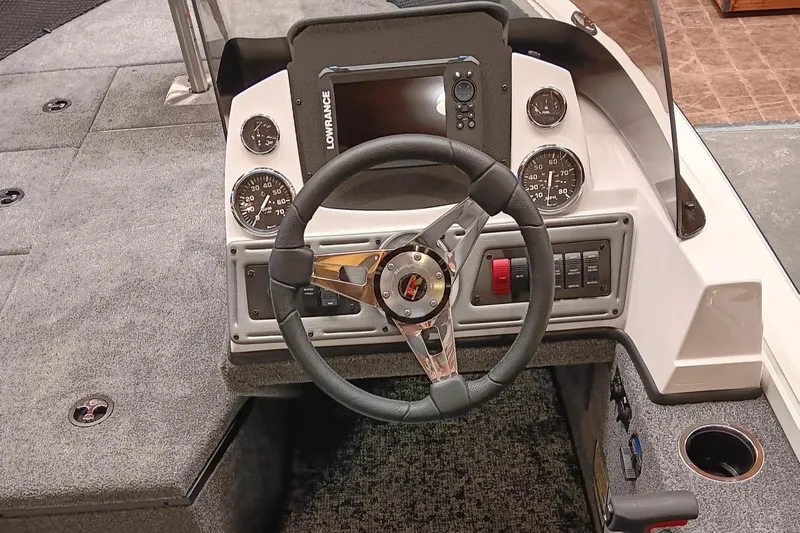 Slide: The Image of 2025 Ranger VS1682SC Reata boat dashboard with steering wheel and control panel. - 3