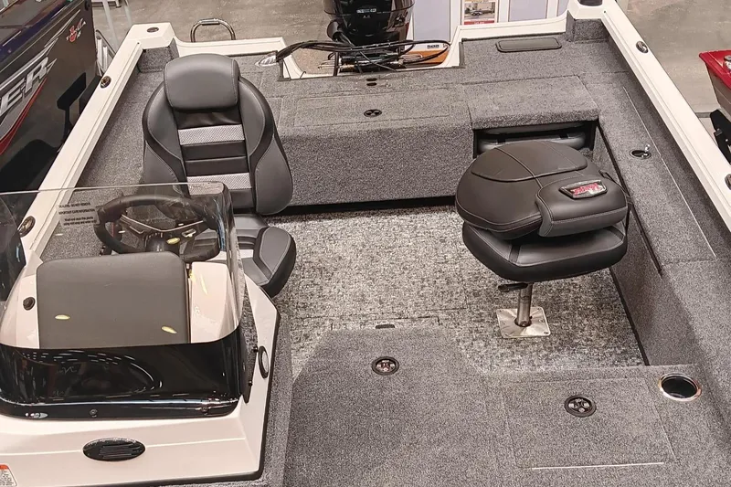 Slide: The Image of 2025 Ranger VS1682SC Reata boat interior with seating and steering console. - 4