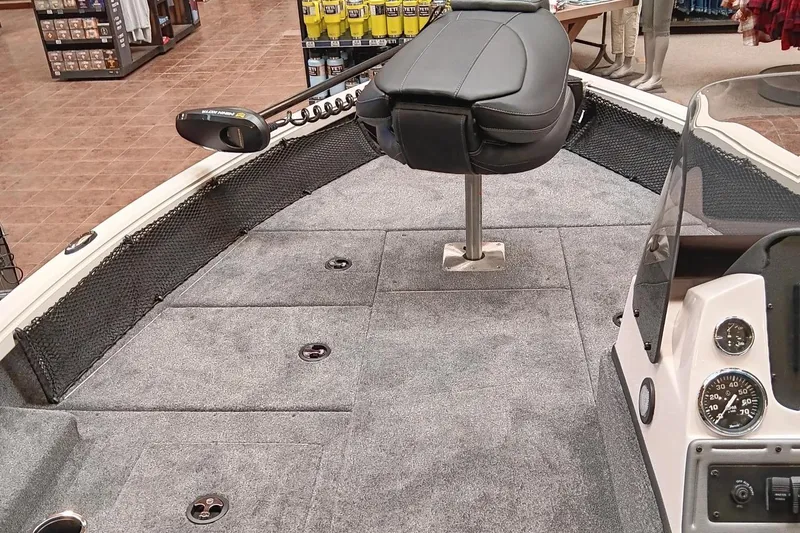 Slide: The Image of 2025 Ranger VS1682SC Reata boat interior with seating and control panel. - 5