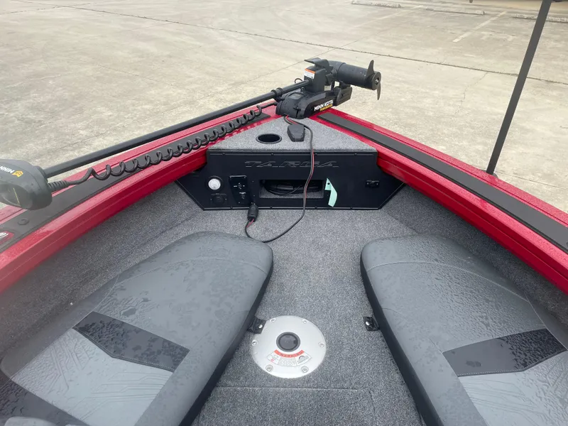 Slide: The Image of 2025 Tracker Targa V-18 Combo boat interior with seating and control panel. - 8