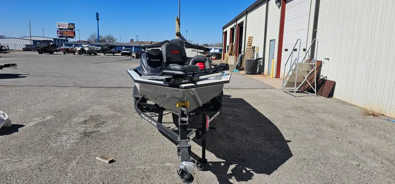 Slide: The Image of 2025 Tracker Pro Team 175 boat on trailer in outdoor lot. - 2