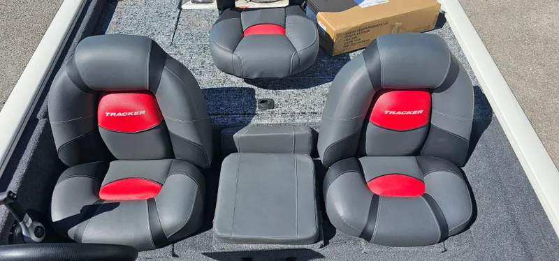 Slide: The Image of 2025 Tracker Pro Team 175 boat interior with gray and red seating. - 6