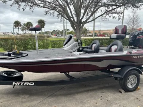 The Image of 2025 Nitro Z17 boat on trailer, parked outdoors, featuring sleek design and modern seating. - 0