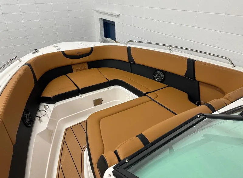Slide: The Image of 2023 Chaparral 280 OSX boat interior with tan and black seating. - 10