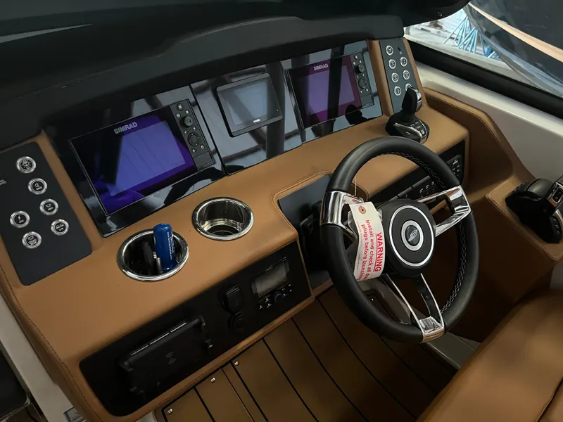 Slide: The Image of 2023 Chaparral 280 OSX dashboard with modern controls and navigation screens. - 9