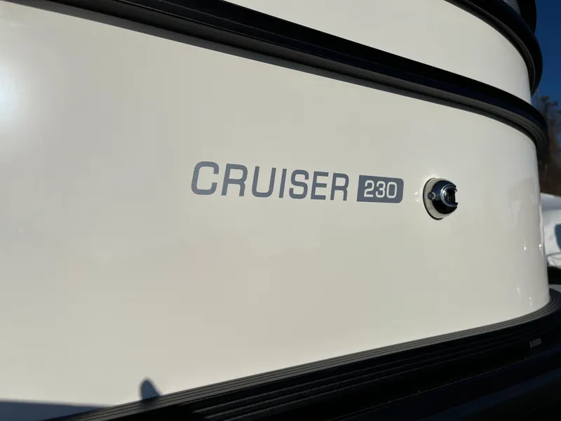 Slide: The Image of 2025 Harris Cruiser 230 boat exterior with model name displayed. - 1